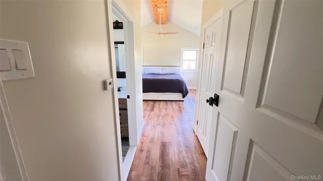 a view of a porch with wooden floor and iron stairs