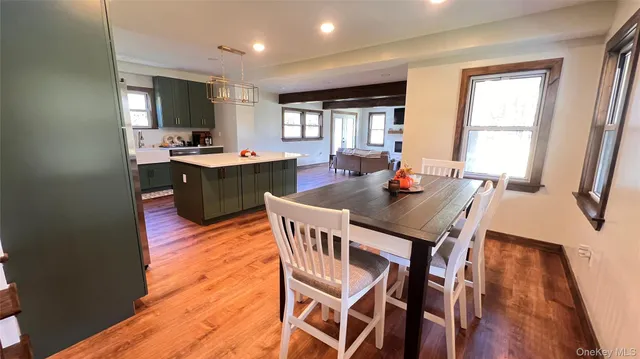 a view of a dining room with furniture and window