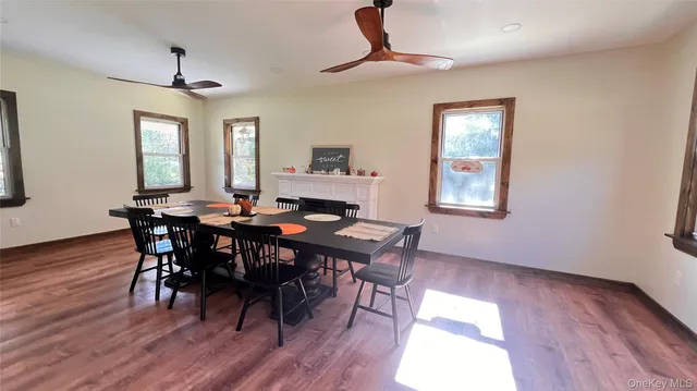 a view of a porch with a table and chairs