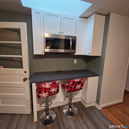 a kitchen with a stove and cabinets
