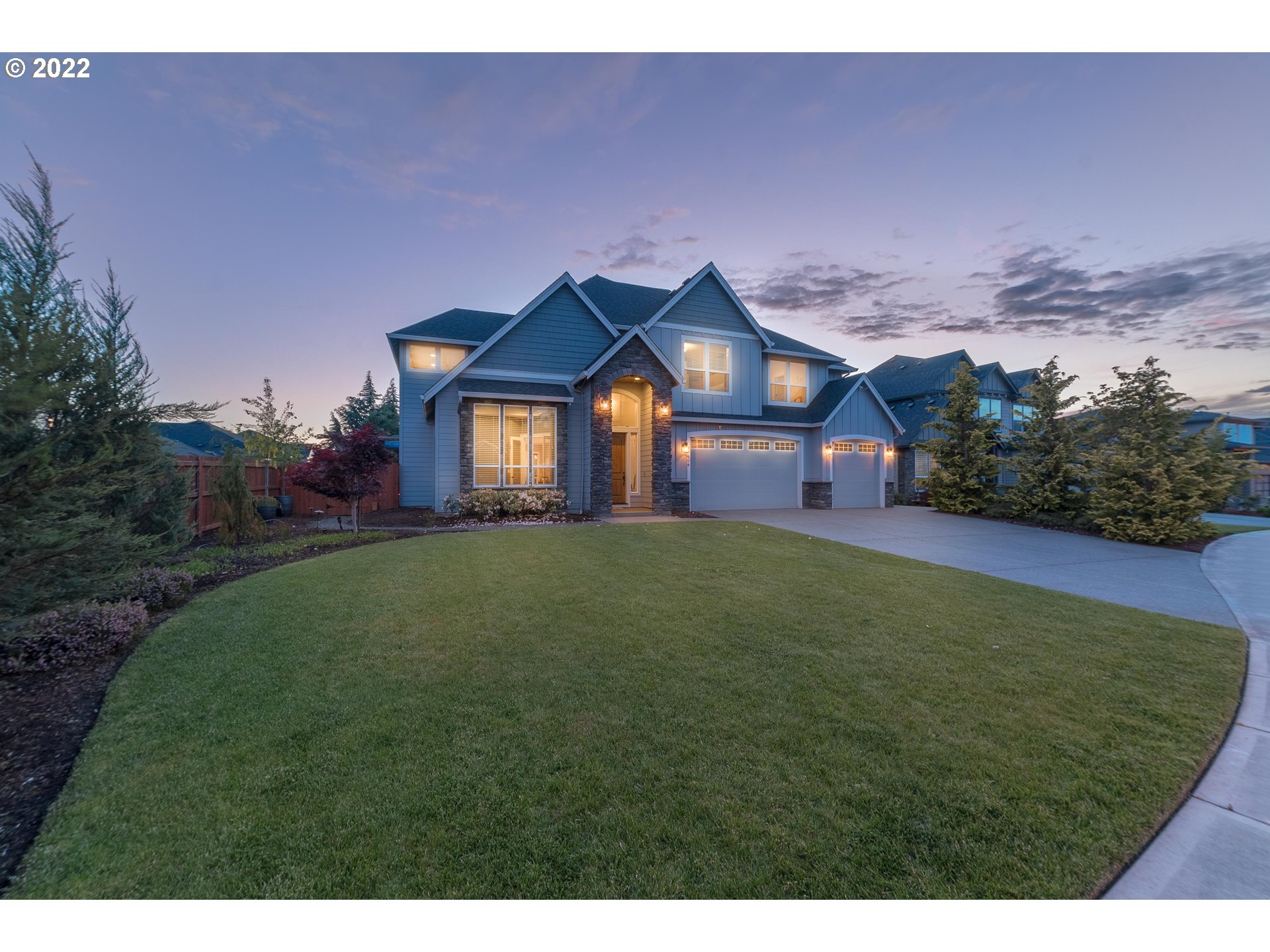 17608 Northeast 26th Avenue Ridgefield, WA 98642 - Photo 1 of 29 a front view of a house with a garden and yard