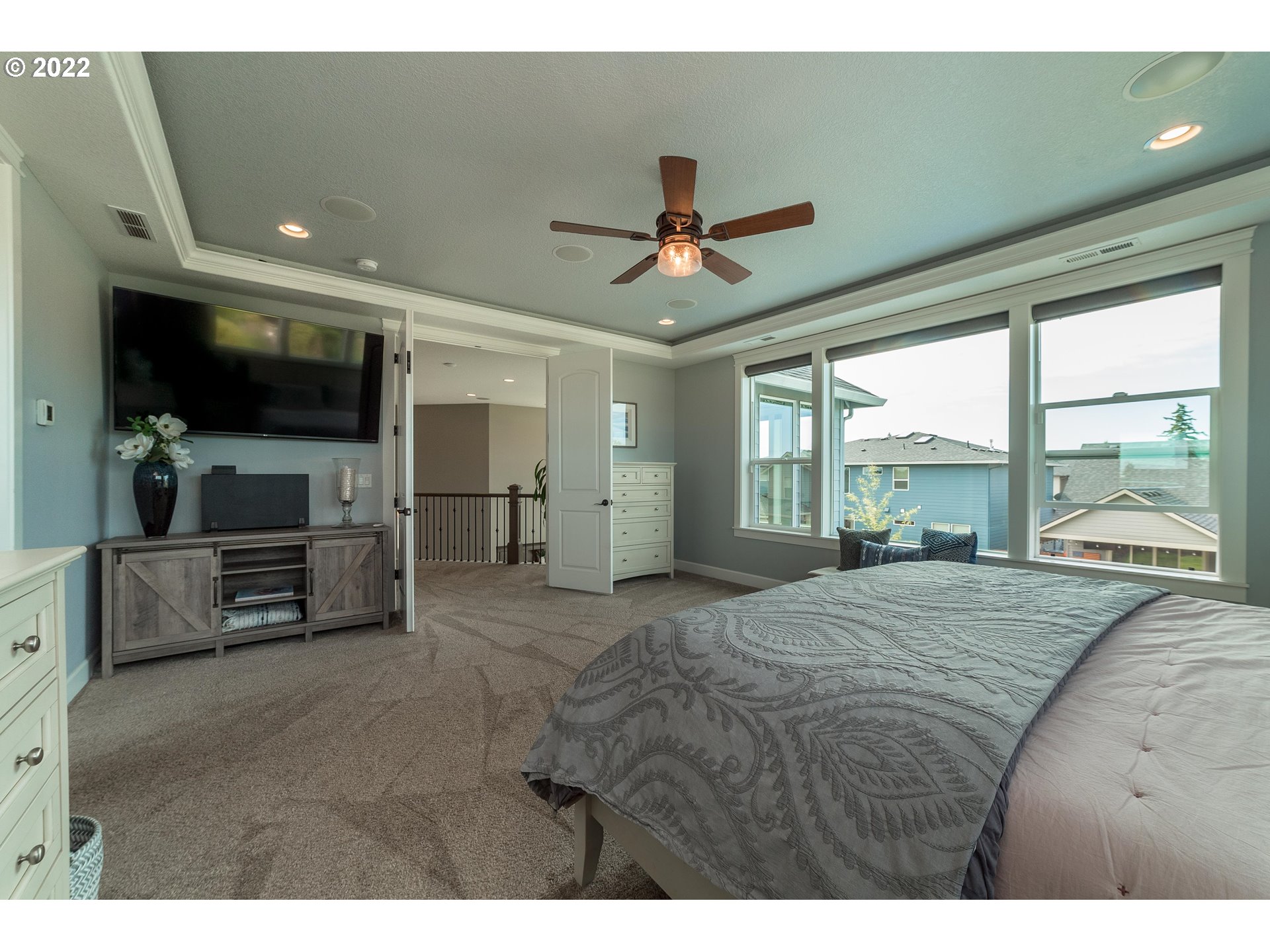 17608 Northeast 26th Avenue Ridgefield, WA 98642 - Photo 16 of 29 a spacious bedroom with a large bed and a flat screen tv