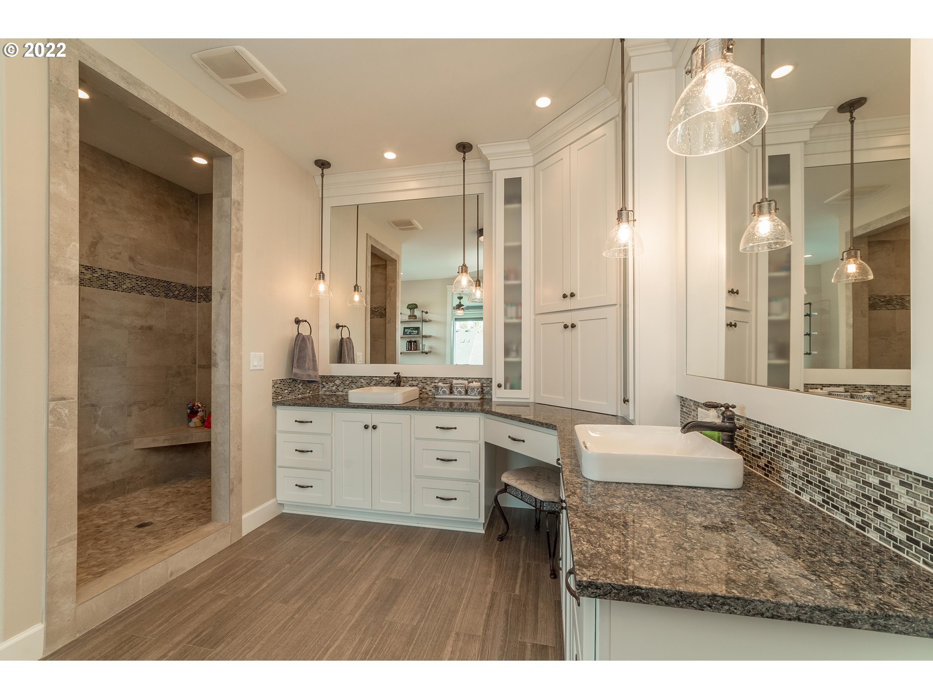 17608 Northeast 26th Avenue Ridgefield, WA 98642 - Photo 18 of 29 a bathroom with a granite countertop sink mirror and shower