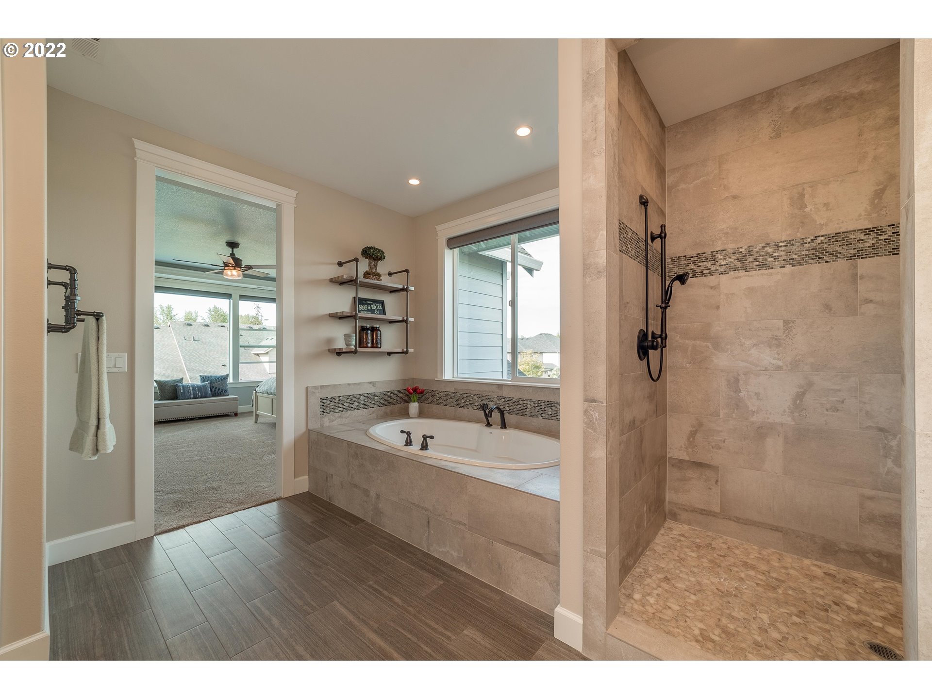 17608 Northeast 26th Avenue Ridgefield, WA 98642 - Photo 19 of 29 a bathroom with a tub sink and mirror