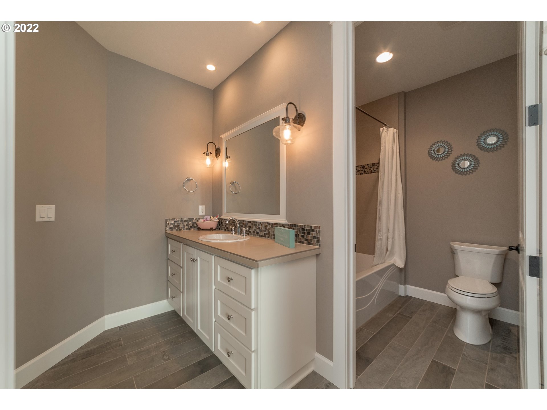 17608 Northeast 26th Avenue Ridgefield, WA 98642 - Photo 22 of 29 a bathroom with a sink a toilet and shower