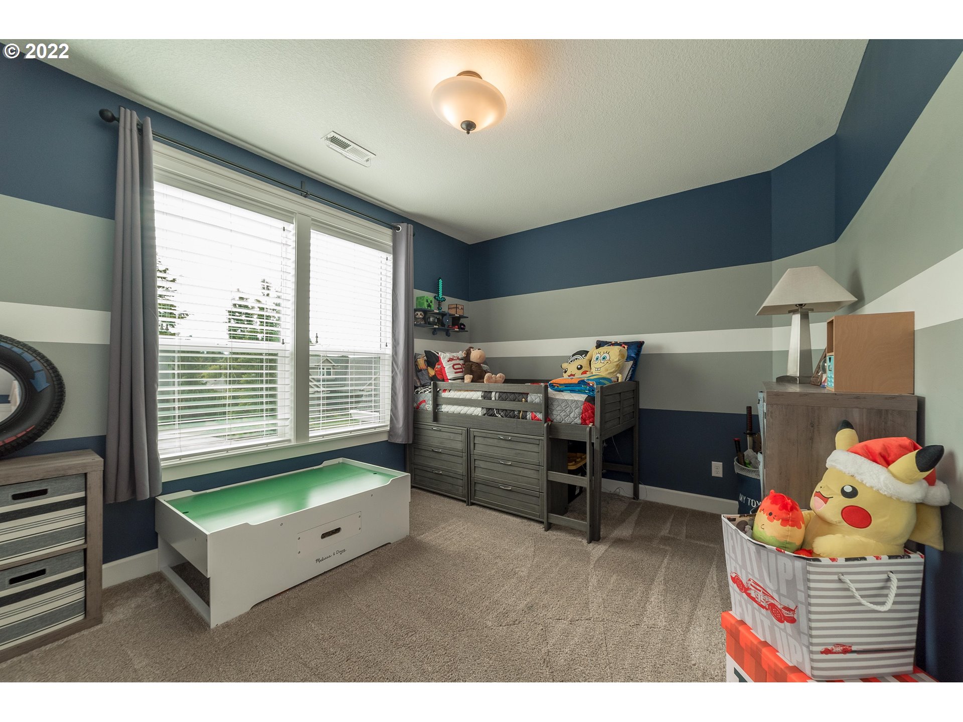 17608 Northeast 26th Avenue Ridgefield, WA 98642 - Photo 23 of 29 a room with furniture and a flat screen tv