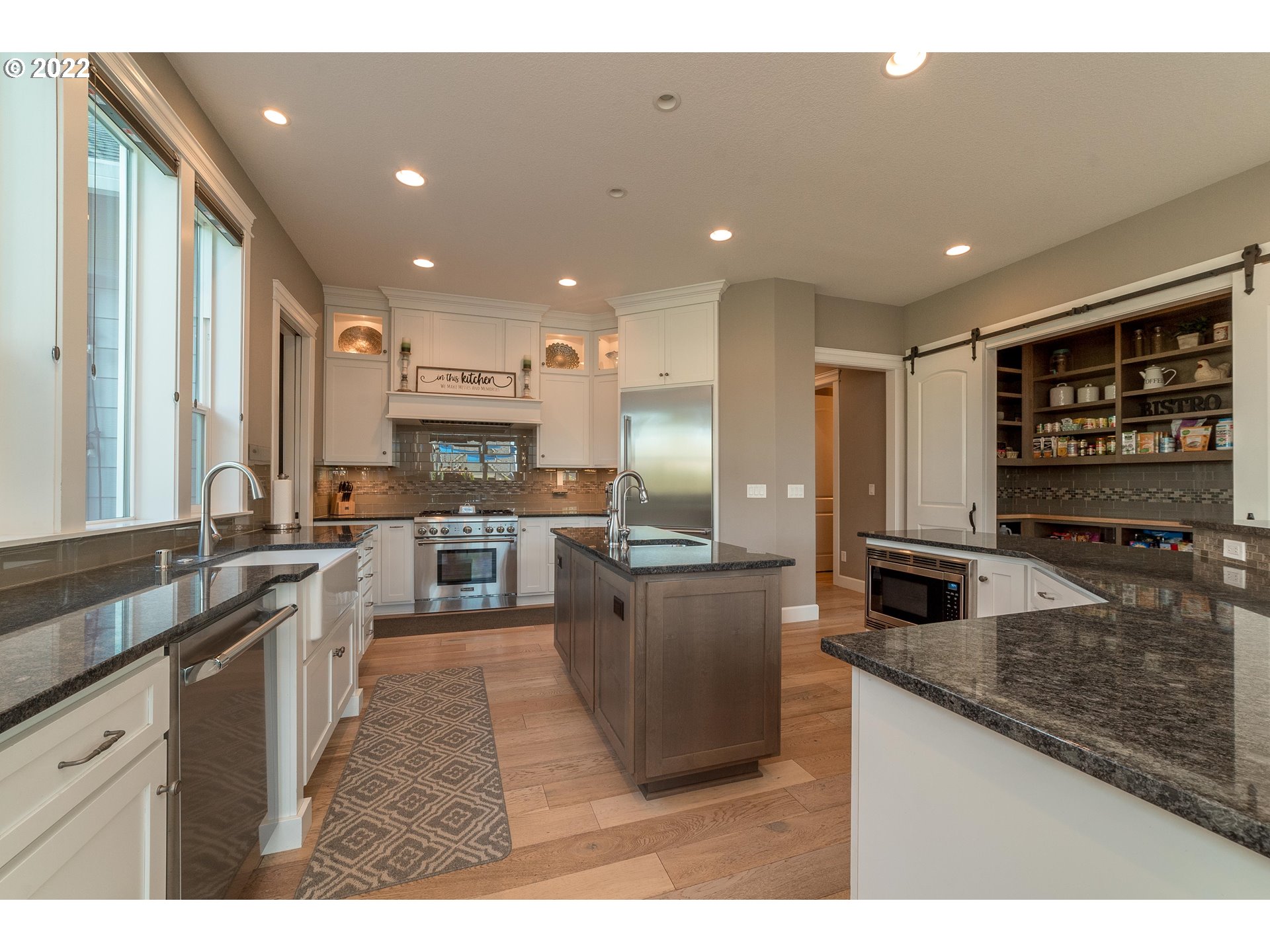 17608 Northeast 26th Avenue Ridgefield, WA 98642 - Photo 6 of 29 a kitchen with stainless steel appliances granite countertop a sink stove and refrigerator