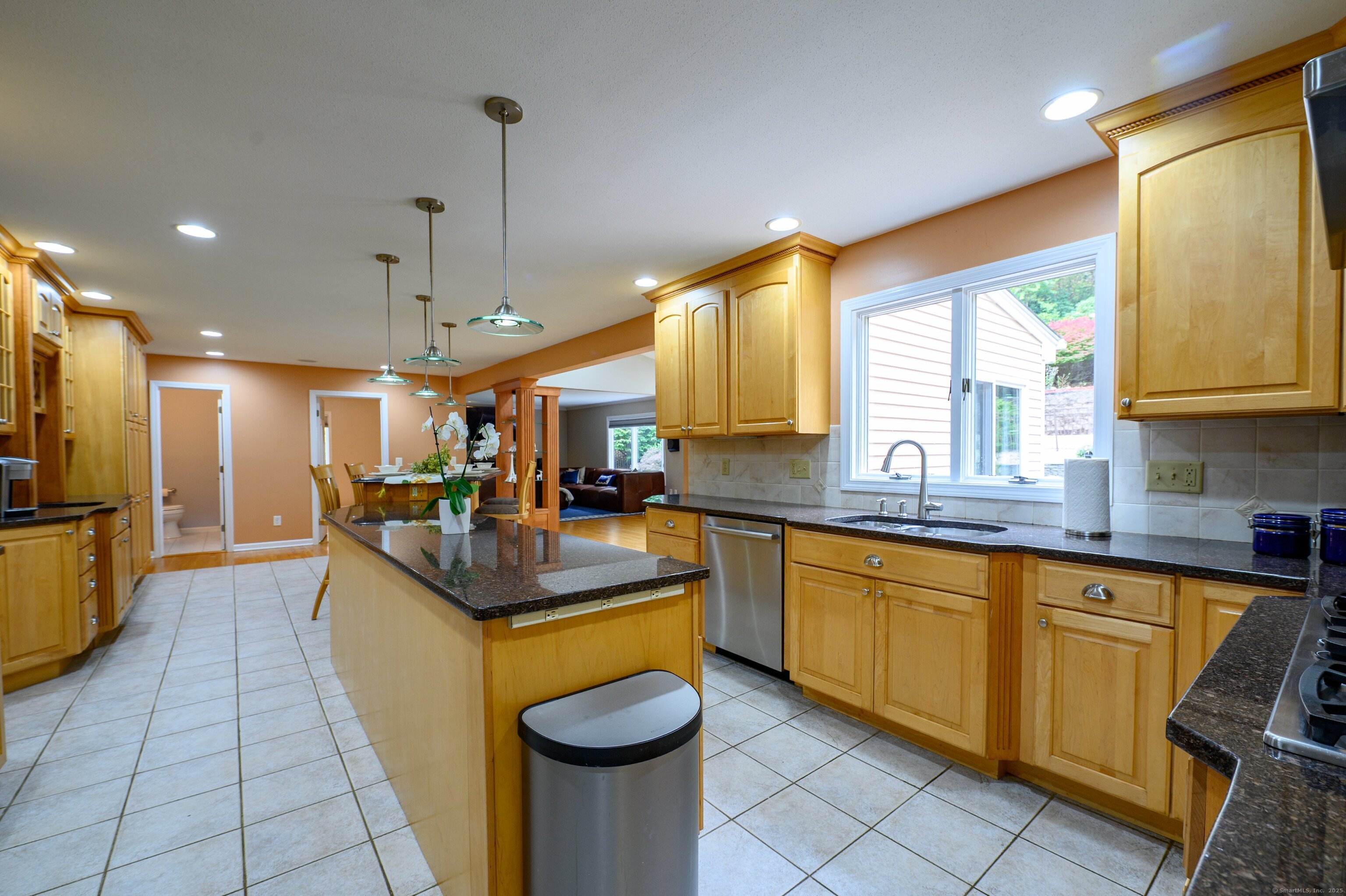 85 Inverness Court Cheshire, CT 06410 - Photo 12 of 40 a large kitchen with kitchen island a large counter space appliances and a window