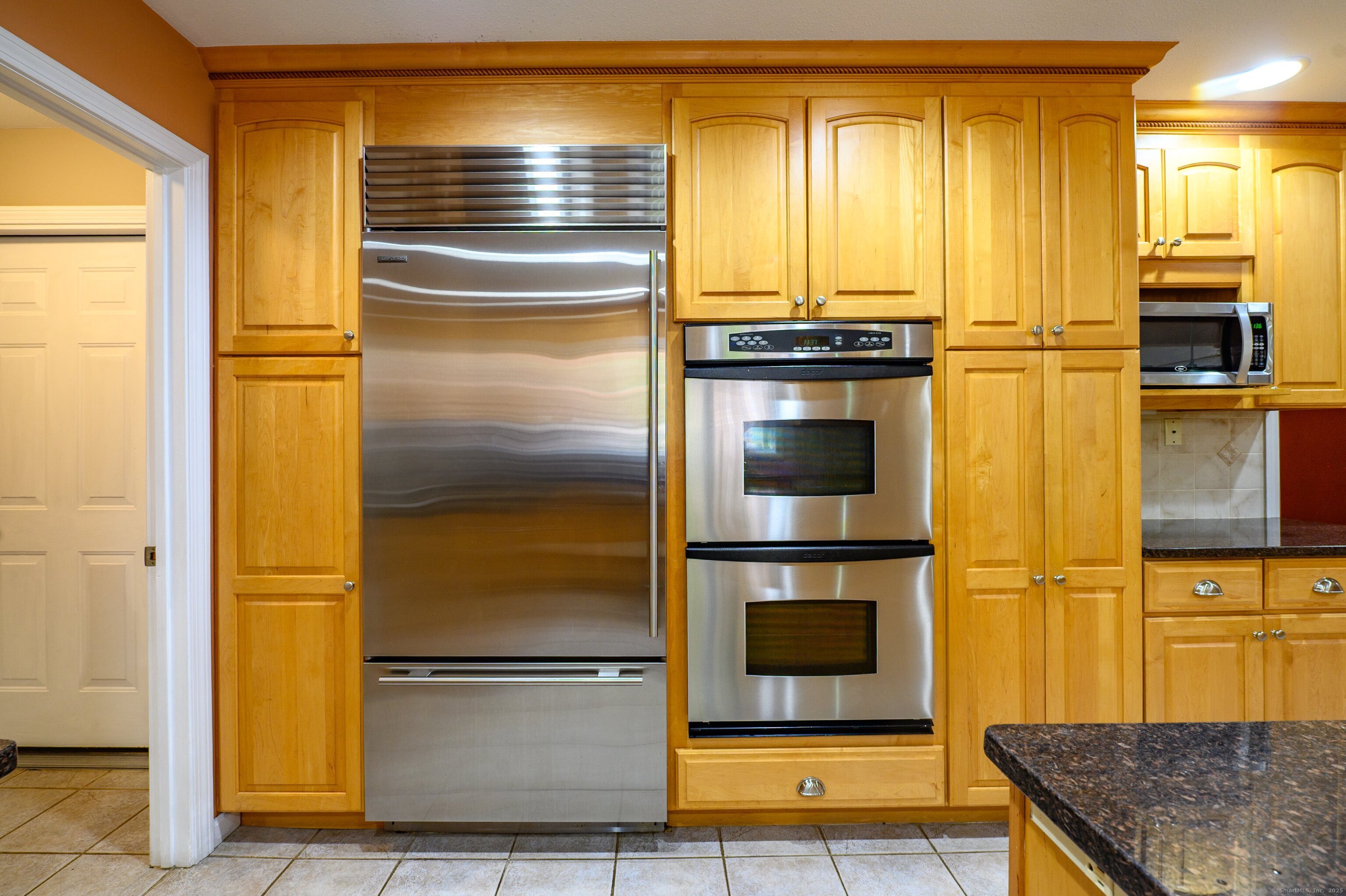 85 Inverness Court Cheshire, CT 06410 - Photo 6 of 40 a kitchen with stainless steel appliances granite countertop a refrigerator and a stove