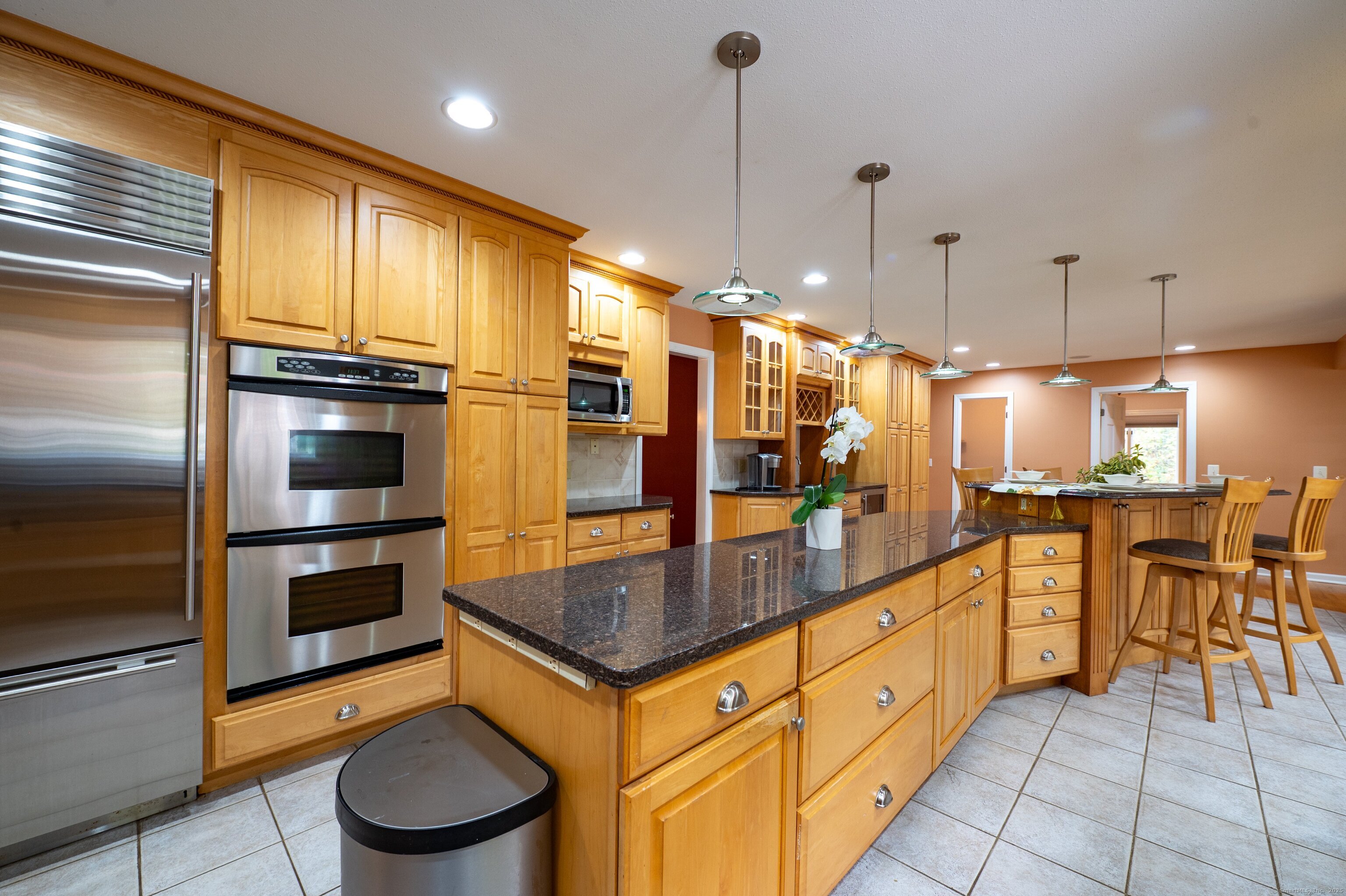 85 Inverness Court Cheshire, CT 06410 - Photo 7 of 40 a kitchen with stainless steel appliances a stove a sink and a refrigerator
