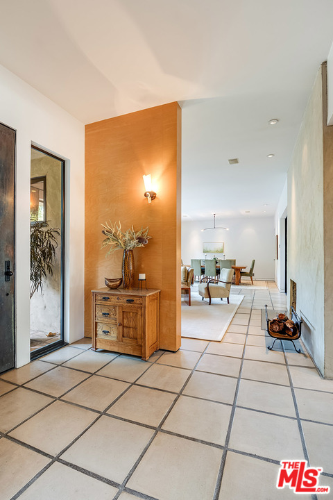 12322 Viewcrest Road Studio City, CA 91604 - Photo 16 of 23 a room with a chair and white cabinets