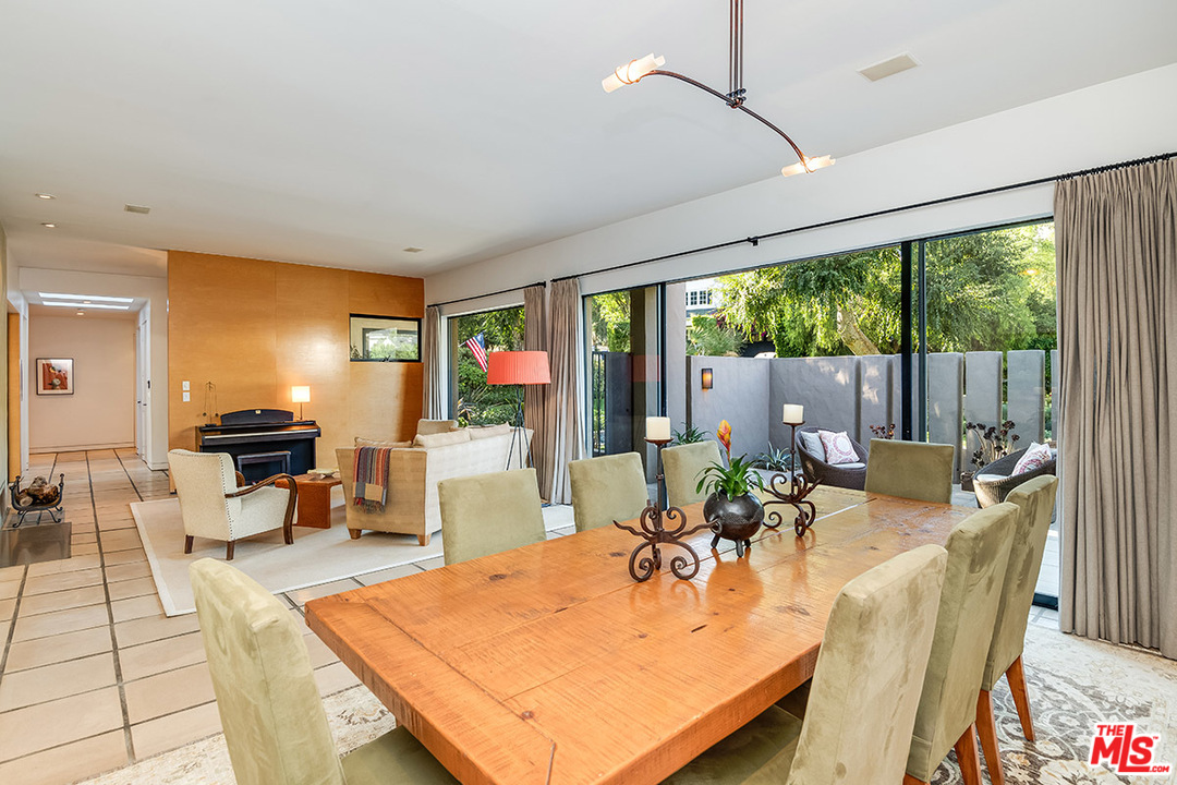 12322 Viewcrest Road Studio City, CA 91604 - Photo 19 of 23 a living room with furniture a large window and dining table