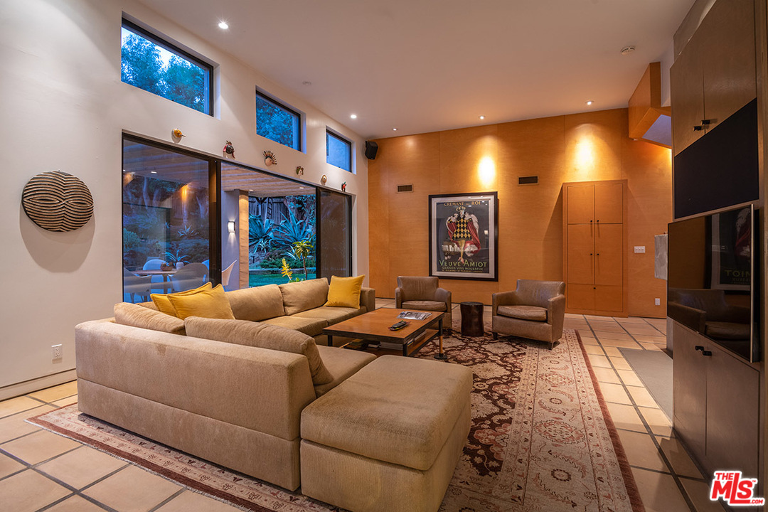 12322 Viewcrest Road Studio City, CA 91604 - Photo 5 of 23 a living room with furniture and a flat screen tv