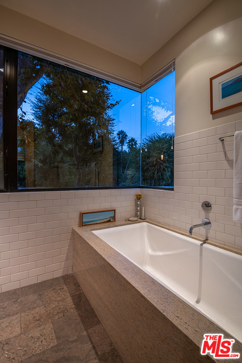 12322 Viewcrest Road Studio City, CA 91604 - Photo 8 of 23 a bathroom with a sink and a bathtub