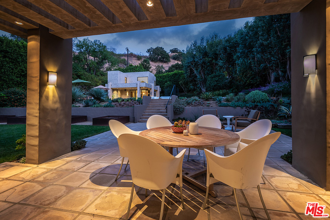 12322 Viewcrest Road Studio City, CA 91604 - Photo 9 of 23 a view of a table and chairs in patio