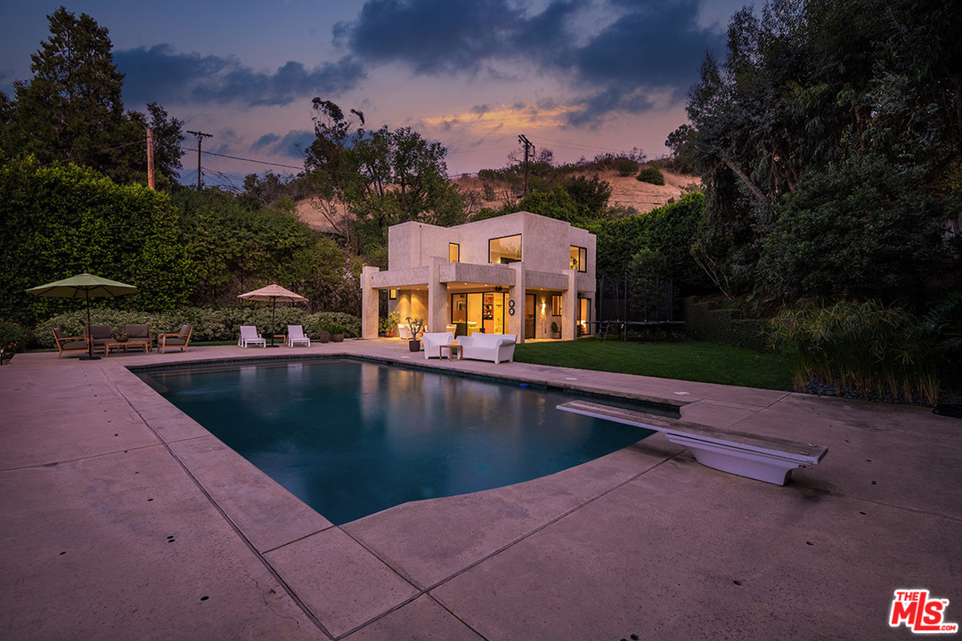 12322 Viewcrest Road Studio City, CA 91604 - Photo 10 of 23 a view of swimming pool with a yard and lake view in back