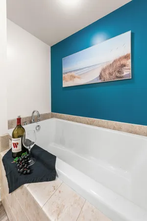 a bathroom with a bathtub and a sink