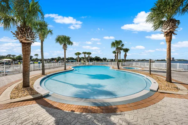 a view of a swimming pool with a lounge chairs