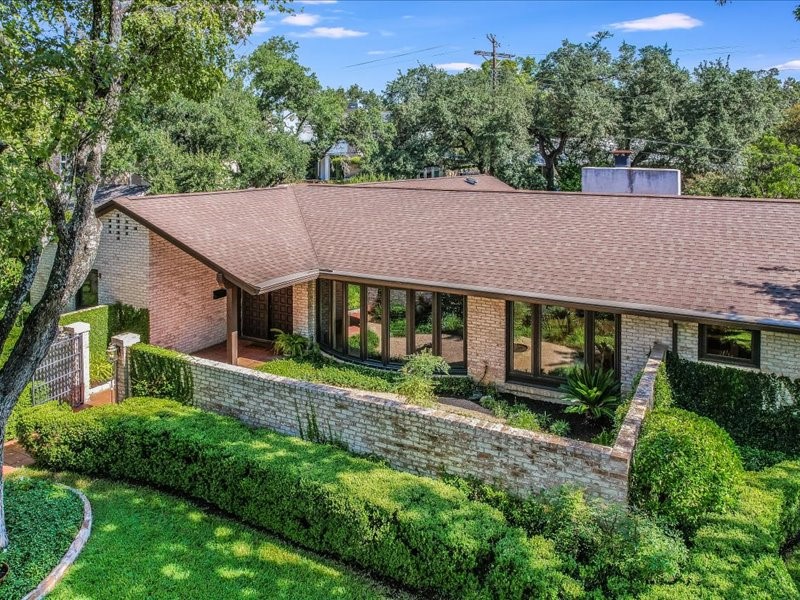 3308 River Road Austin, TX 78703 - Photo 1 of 1 a aerial view of a house next to a big yard and large trees