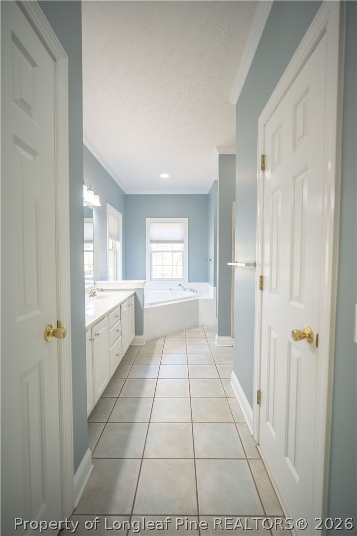 6826 Surrey Road Fayetteville, NC 28306 - Photo 26 of 50 a bathroom with a vanity and a shower