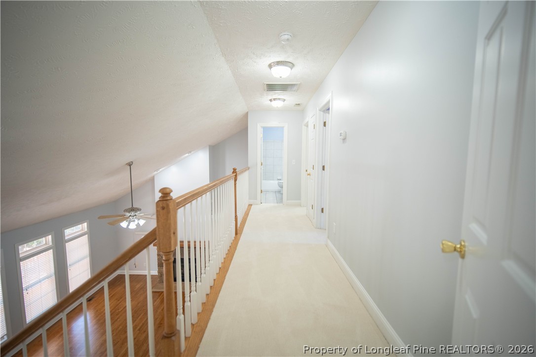 6826 Surrey Road Fayetteville, NC 28306 - Photo 34 of 50 a view of a hallway with stairs
