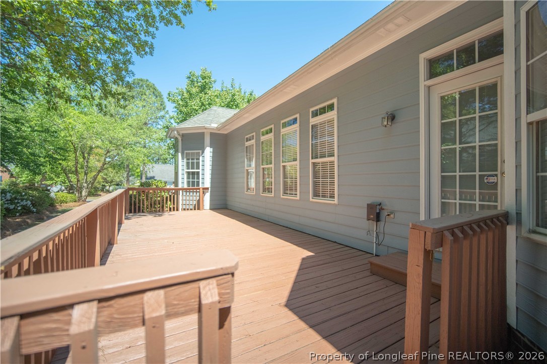 6826 Surrey Road Fayetteville, NC 28306 - Photo 48 of 50 a balcony with wooden floor and fence