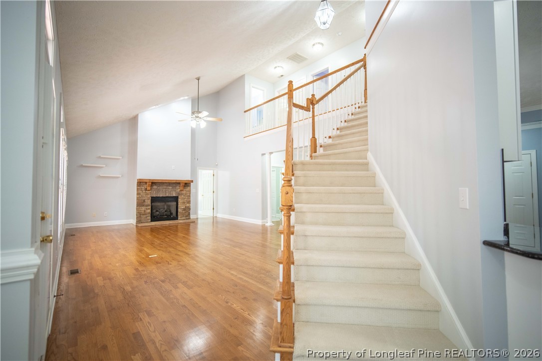 6826 Surrey Road Fayetteville, NC 28306 - Photo 7 of 50 a view of a livingroom with wooden floor and a fireplace