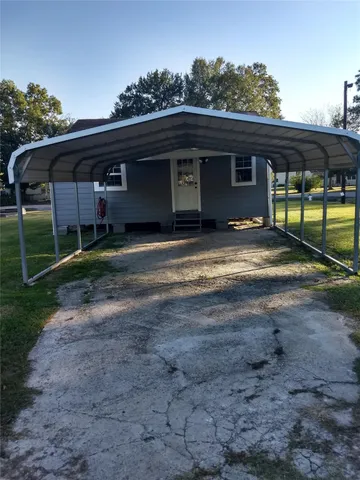 a view of a house with backyard space