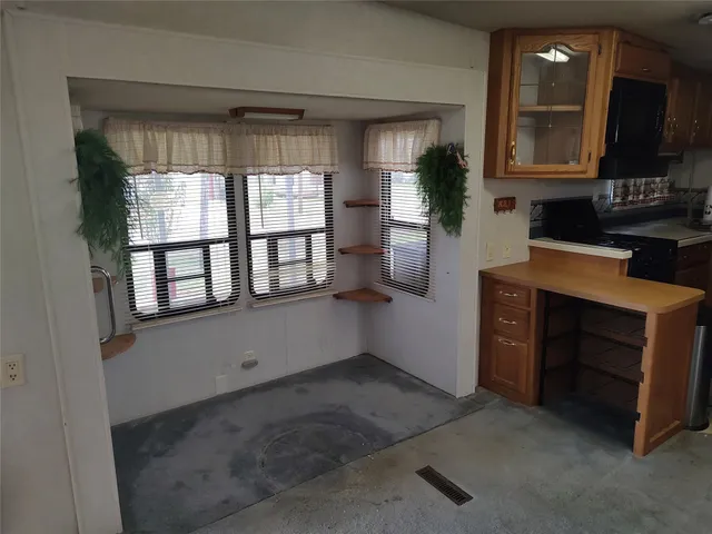 a room with window and cabinet