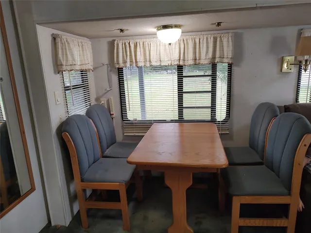 a view of a dining room with furniture