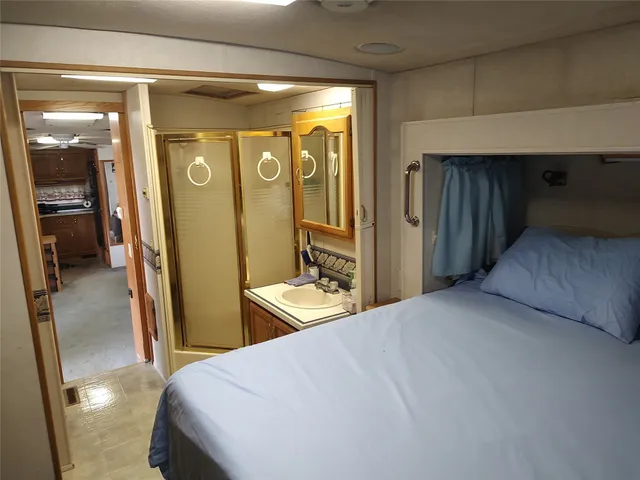 a bedroom with a bed and a dresser