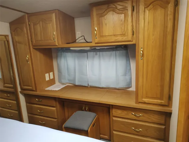 a view of cabinets and wooden floor