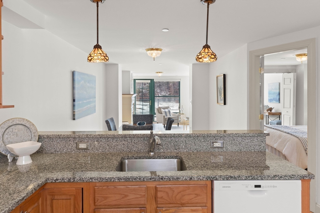 60 Merrimac Street, Unit 907 Amesbury, MA 01913 - Photo 11 of 23 a bathroom with sink granite and a granite counter top