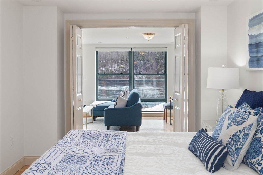 60 Merrimac Street, Unit 907 Amesbury, MA 01913 - Photo 17 of 23 a living room with furniture and a window