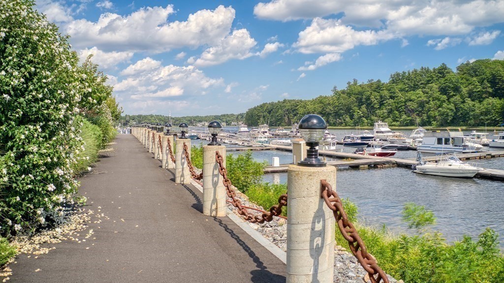60 Merrimac Street, Unit 907 Amesbury, MA 01913 - Photo 21 of 23 a view of a lake with houses