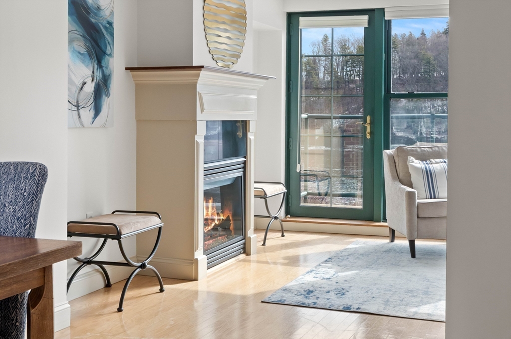 60 Merrimac Street, Unit 907 Amesbury, MA 01913 - Photo 7 of 23 a living room with furniture and a window