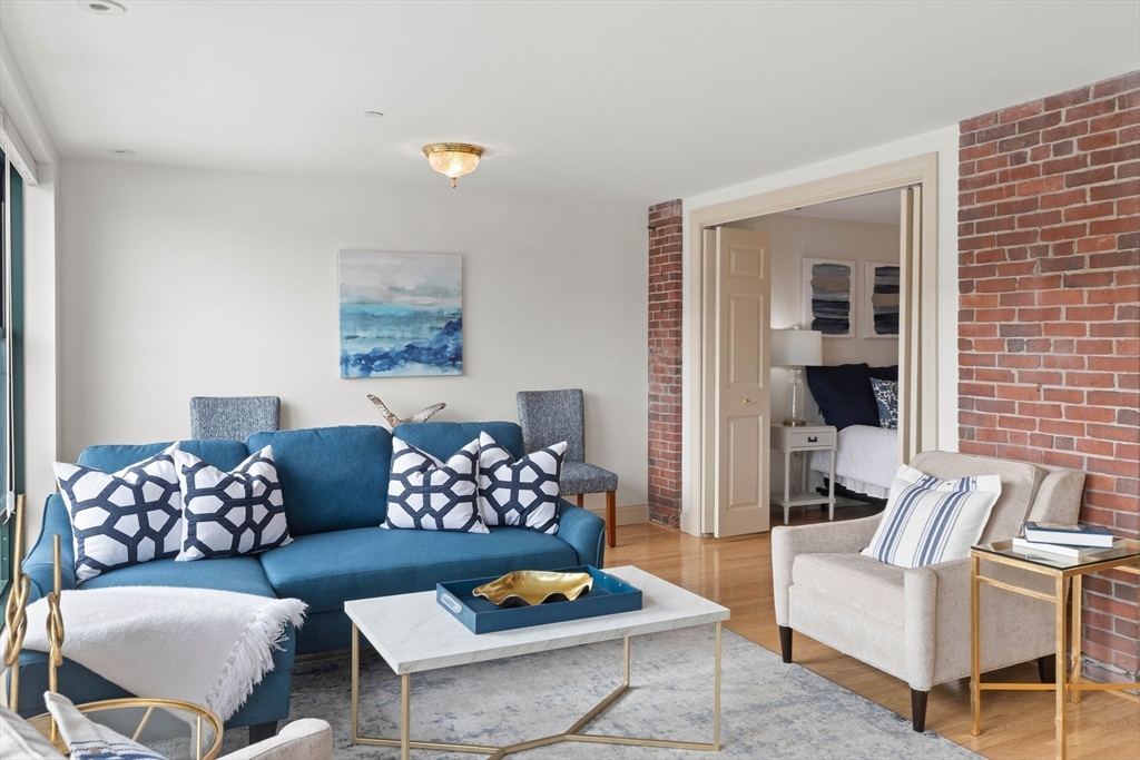 60 Merrimac Street, Unit 907 Amesbury, MA 01913 - Photo 9 of 23 a living room with furniture