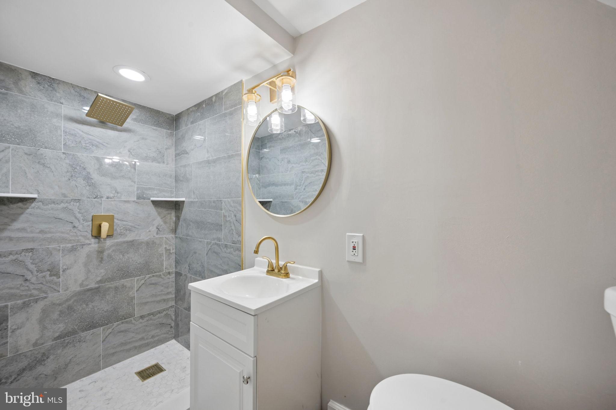 1108 South Clinton Street Baltimore, MD 21224 - Photo 54 of 66 Sleek modern bathroom with elegant finishes.