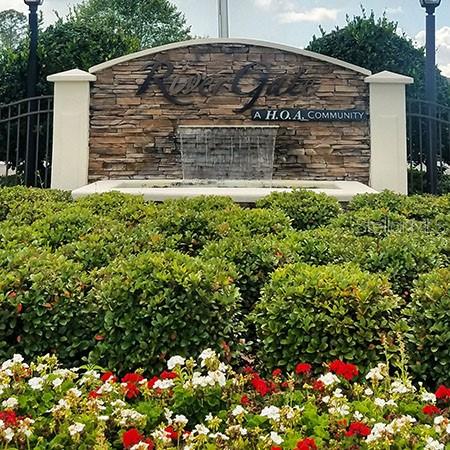 107 Raintree Circle Palm Coast, FL 32164 - Photo 20 of 46 a sign that is in front of flowers