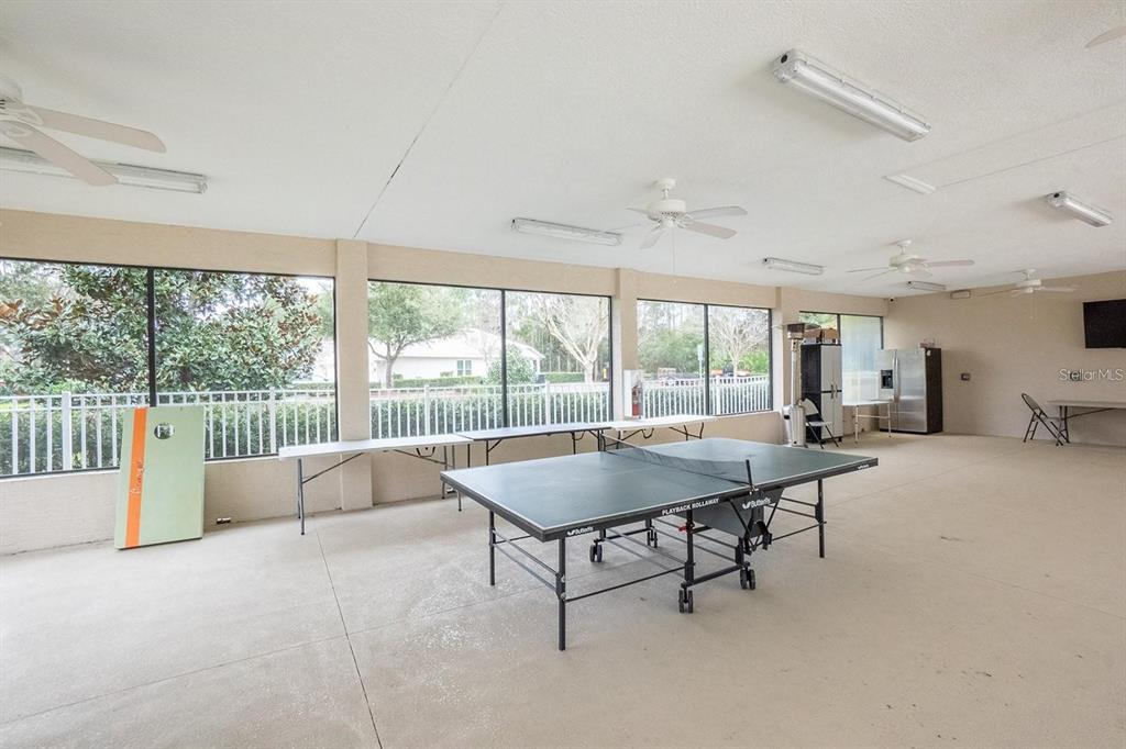 107 Raintree Circle Palm Coast, FL 32164 - Photo 24 of 46 a living room with furniture and a large window