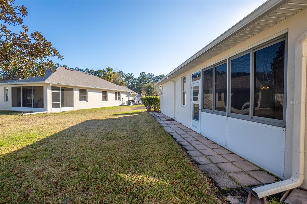 107 Raintree Circle Palm Coast, FL 32164 - Photo 25 of 46 a view of a house with a backyard