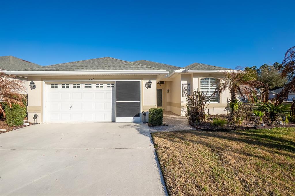107 Raintree Circle Palm Coast, FL 32164 - Photo 26 of 46 a view of a house with a yard