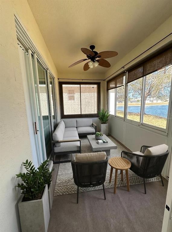 107 Raintree Circle Palm Coast, FL 32164 - Photo 27 of 46 a living room with furniture and a large window