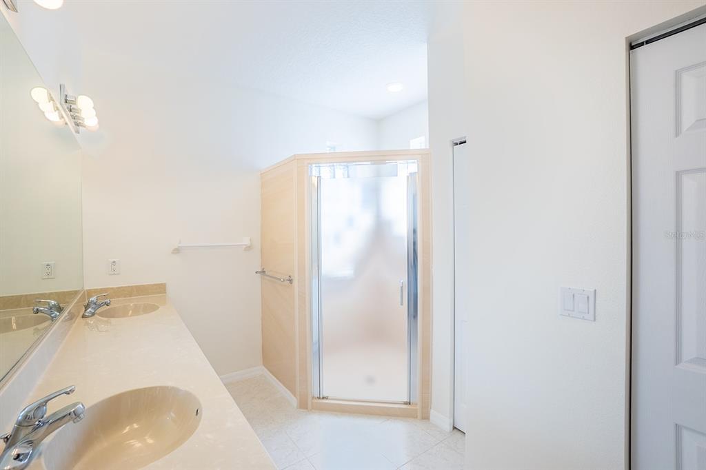 107 Raintree Circle Palm Coast, FL 32164 - Photo 30 of 46 a bathroom with a sink and a mirror