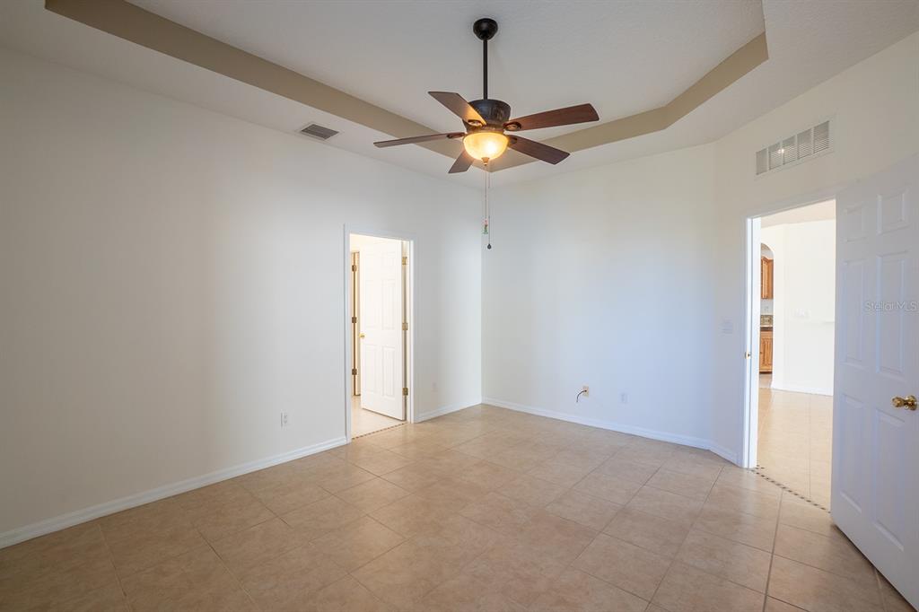 107 Raintree Circle Palm Coast, FL 32164 - Photo 37 of 46 a view of a chandelier fan in a room