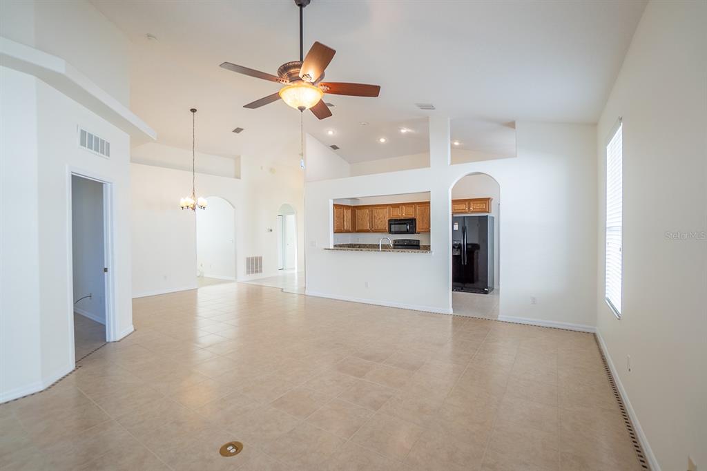 107 Raintree Circle Palm Coast, FL 32164 - Photo 44 of 46 wooden floor in an empty room with a window