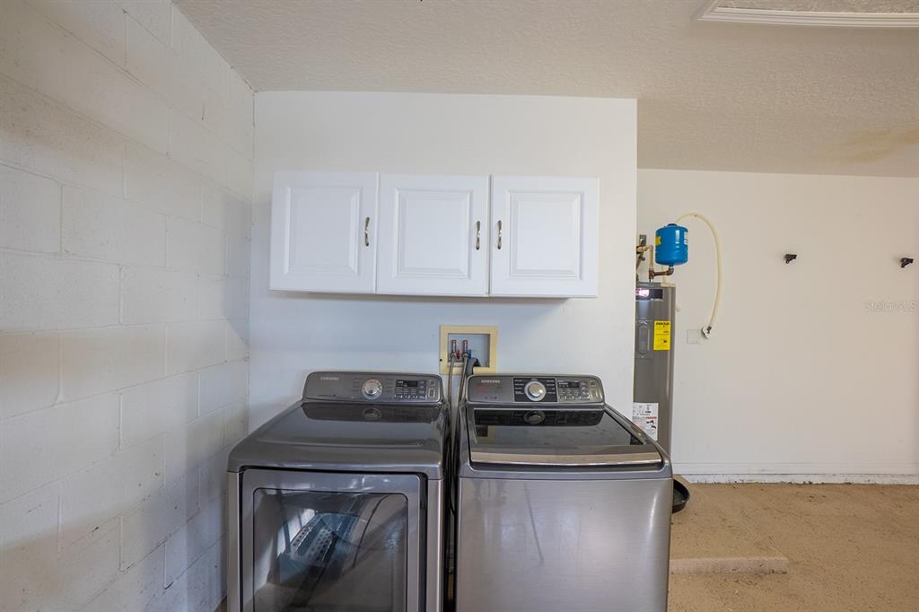 107 Raintree Circle Palm Coast, FL 32164 - Photo 45 of 46 a kitchen with a stove and a refrigerator