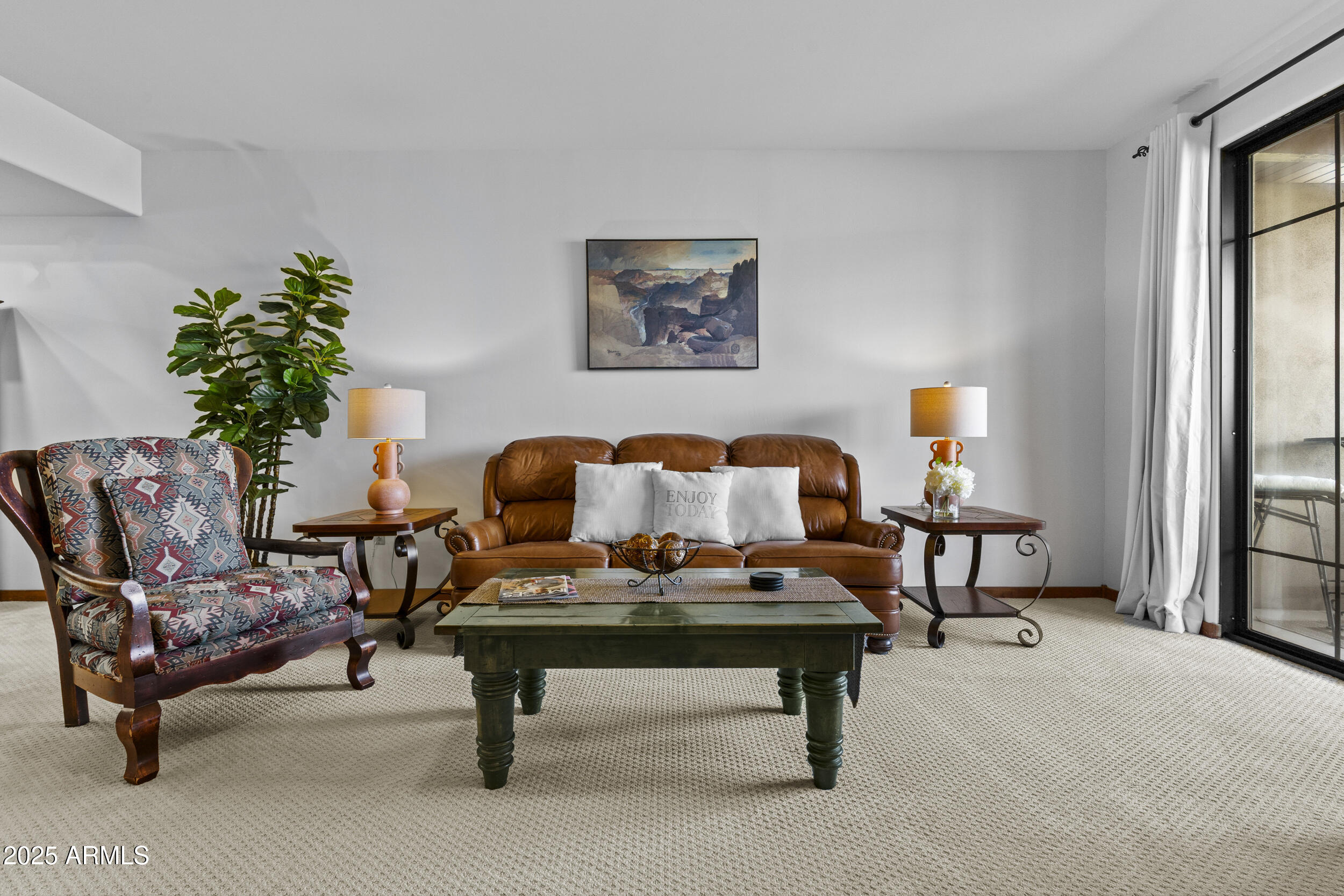 36601 North Mule Train Road, Unit D18 Carefree, AZ 85377 - Photo 11 of 53 a living room with furniture and a potted plant