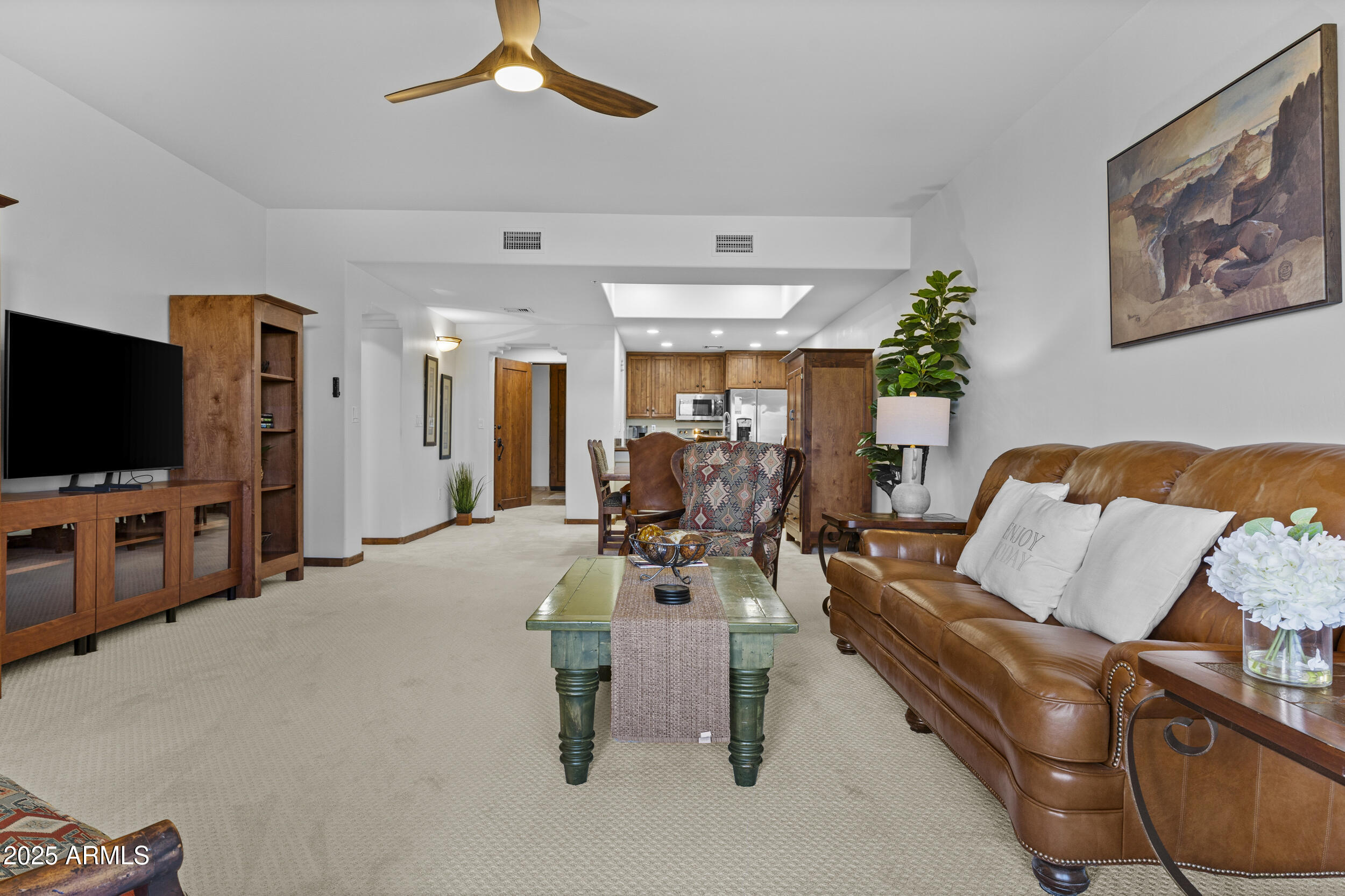 36601 North Mule Train Road, Unit D18 Carefree, AZ 85377 - Photo 14 of 53 a living room with furniture and a flat screen tv