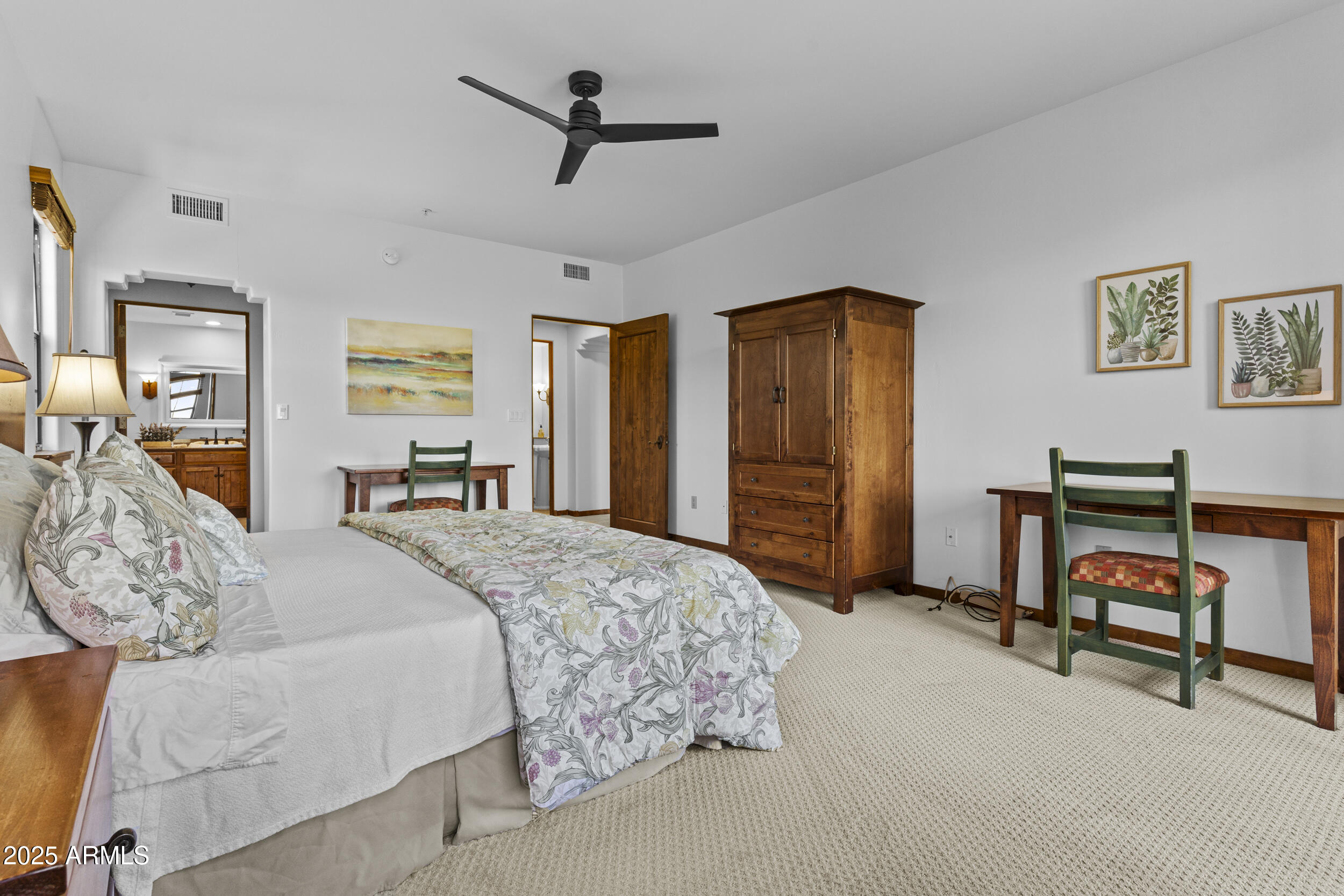 36601 North Mule Train Road, Unit D18 Carefree, AZ 85377 - Photo 18 of 53 a bedroom with a bed dresser and a window